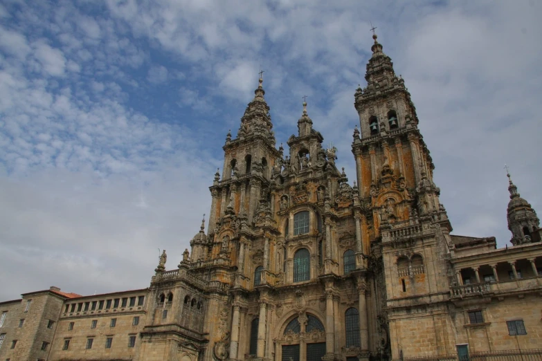 two towers that have clocks above them near each other