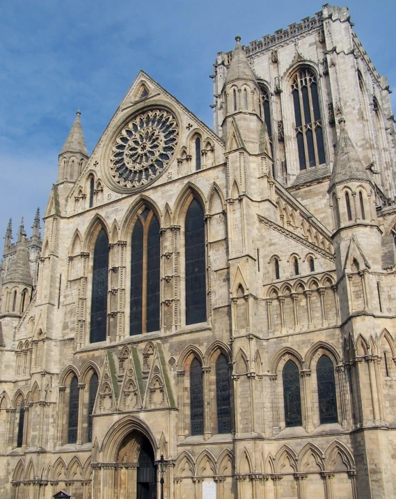 a large cathedral with a huge stone clock tower