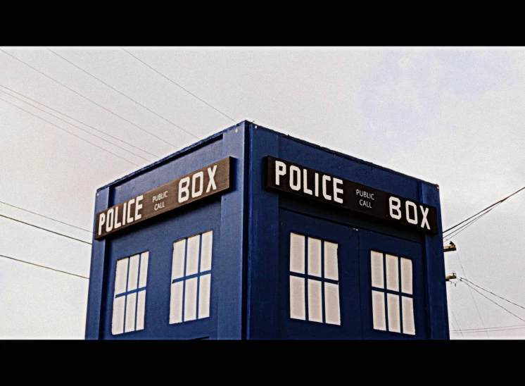 a large blue police box on top of a pole