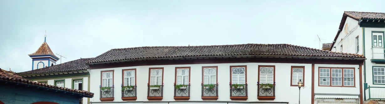 an old building with a tower in front of it