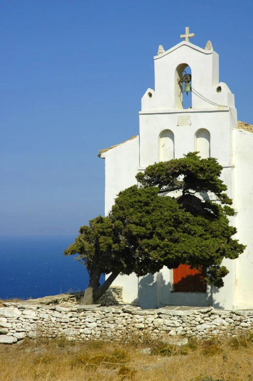 the exterior of an old church near the ocean