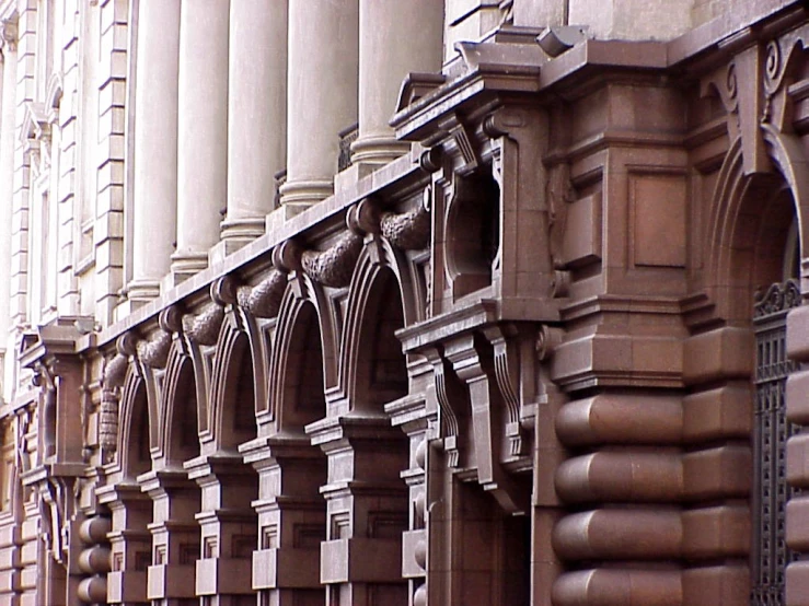 a large ornate wall hanging next to a building