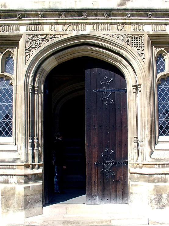 a doorway inside an old style building with carved architecture