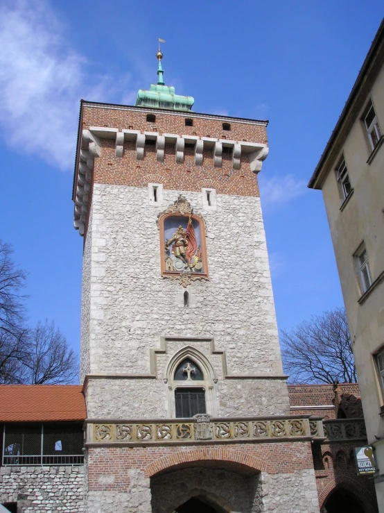 a stone clock tower sitting on the side of a building