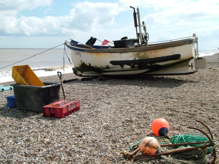 a boat on a rocky shore near a beach