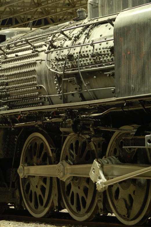 an old fashioned steam train sits in the station