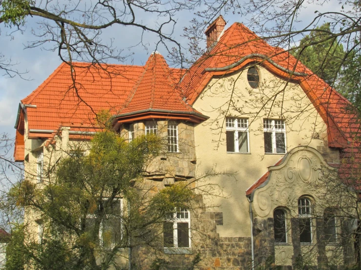 an older building with orange roof and arched windows