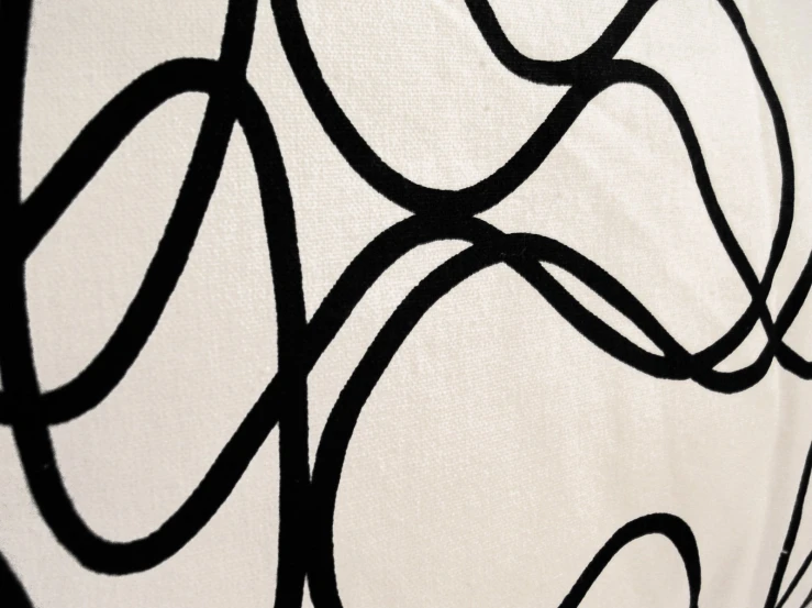 a pograph with a white background and black swirls