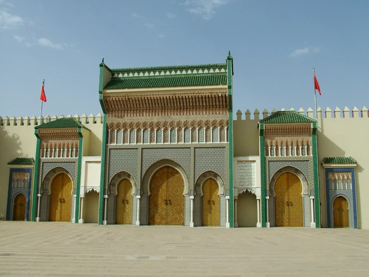 the two - story building is made from wood and stucco