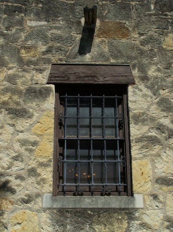 window on wall with bars and bars in frame