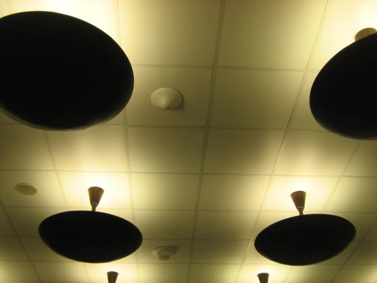 several round lamps hanging from the ceiling