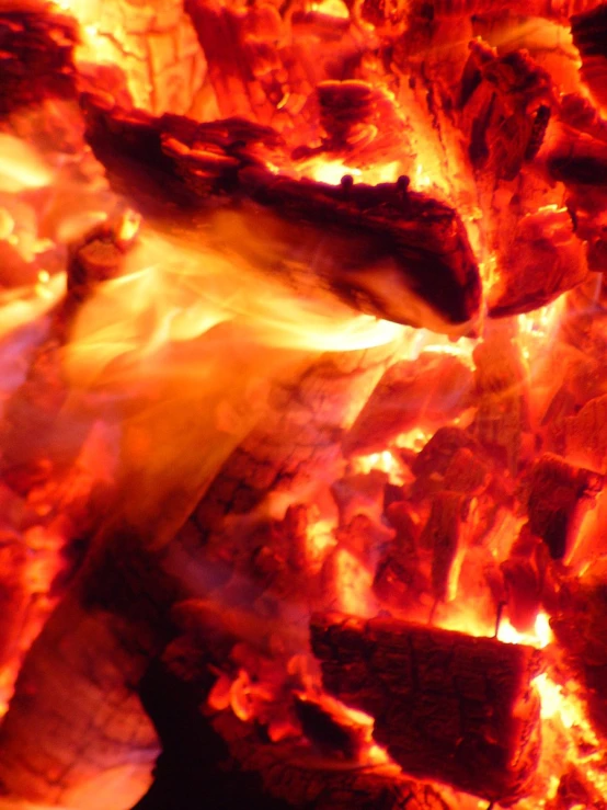 a close up picture of a fire with flames