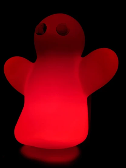 a dark red lit light like a teddy bear