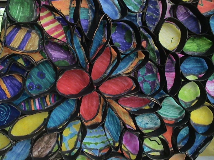 a sculpture of many colorful glass petals