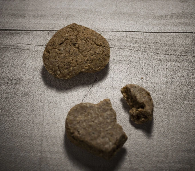 three biscuits in the shape of heart shaped cookies