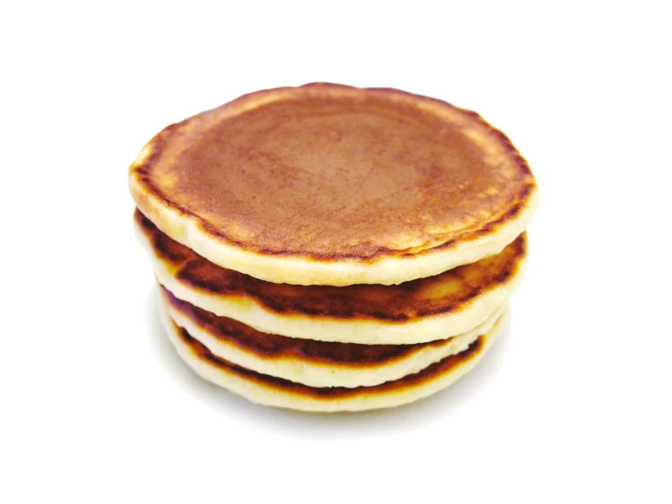 stack of pancakes on a white surface
