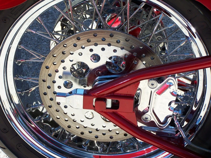 red handlebars and a motorcycle wheel on the ground