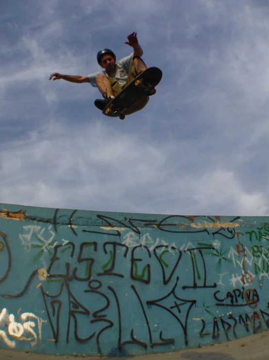 a skateboarder in mid air after doing a trick