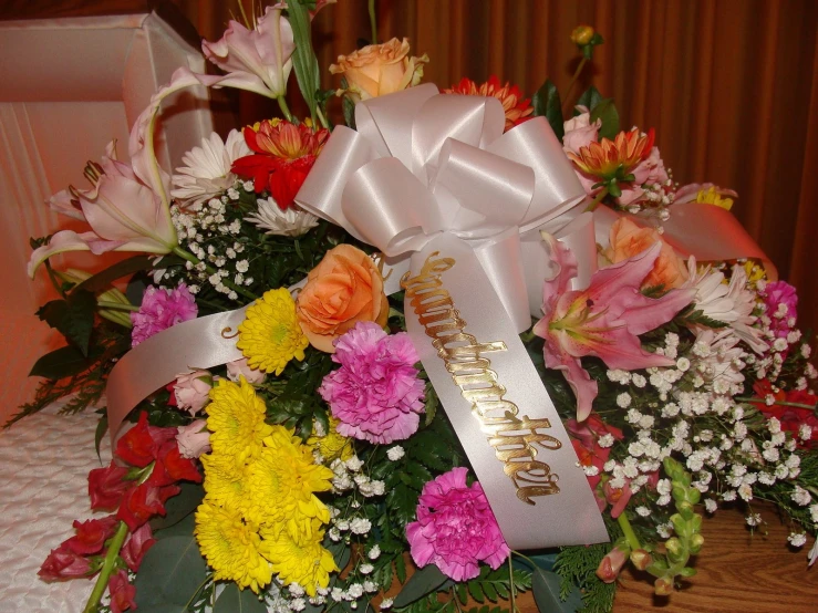 the bouquet has flowers around it on the table