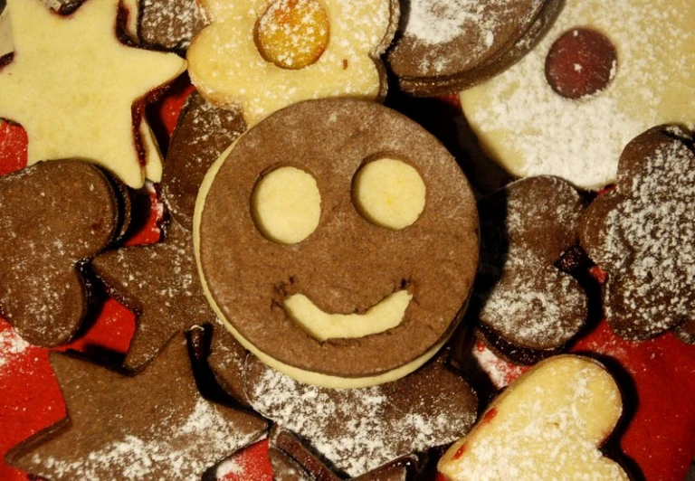 some cookies are on a counter and there is a smiling face