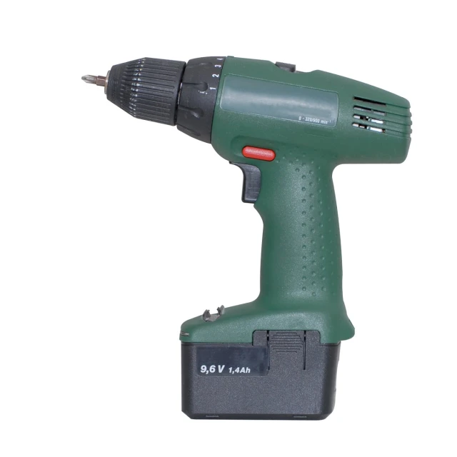a green electric drill, with an impact and a white background