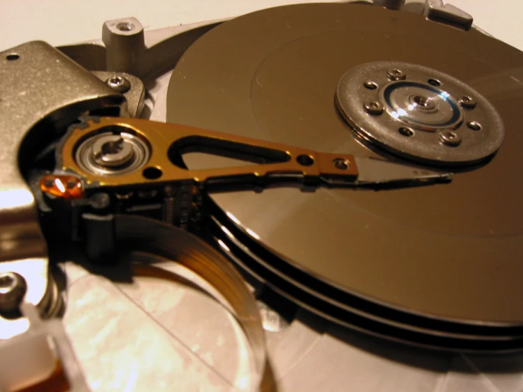 an open hard drive being cut into quarters