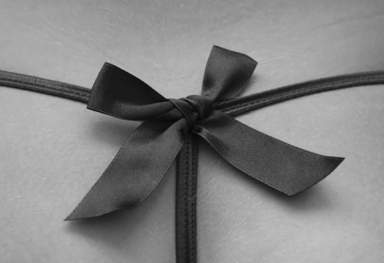 the woman's  is tied with black ribbons