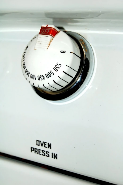 the dial on an oven is very white