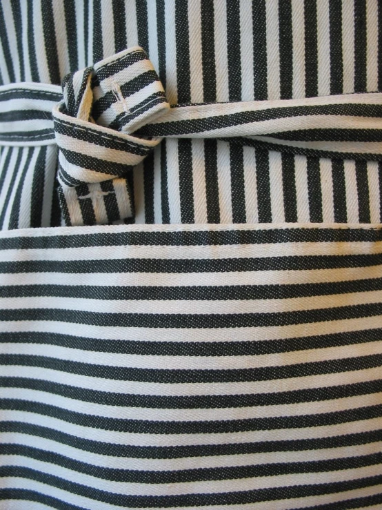 the striped dress features a bow at the back