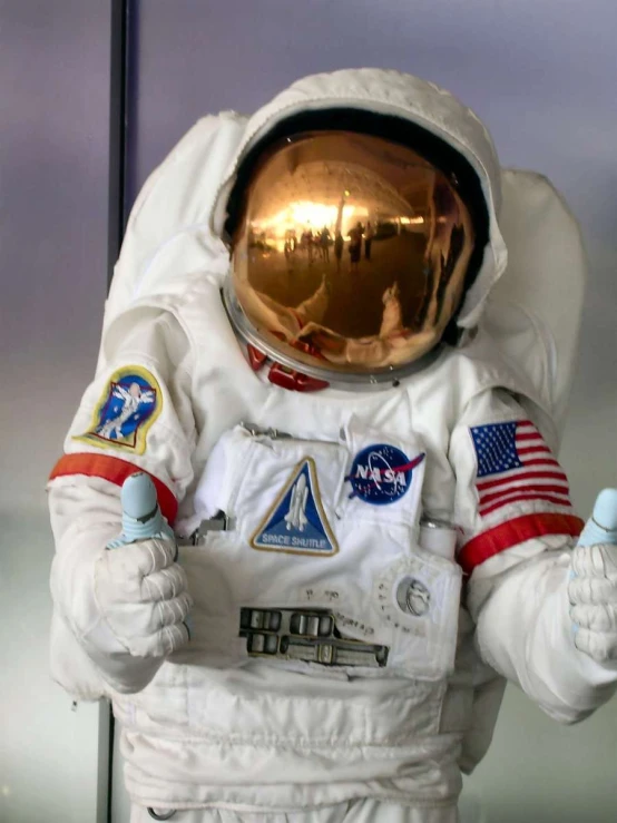 an astronaut with red, white and blue on his clothes