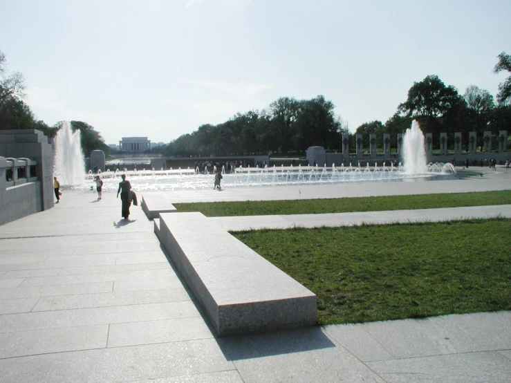 a number of people near a large fountain