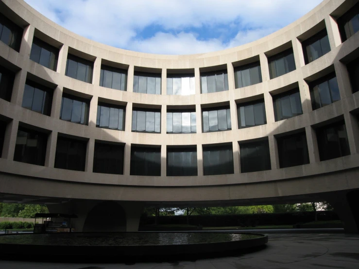 an artistic view of a building's circular courtyard