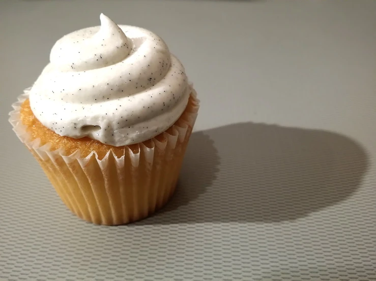 a close up of a cupcake with icing on top