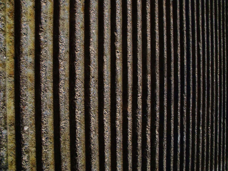 an abstract rusty textured wall is shown
