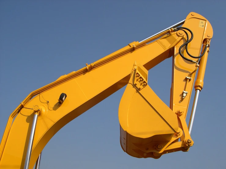 closeup image of a backhoe with its crane extended