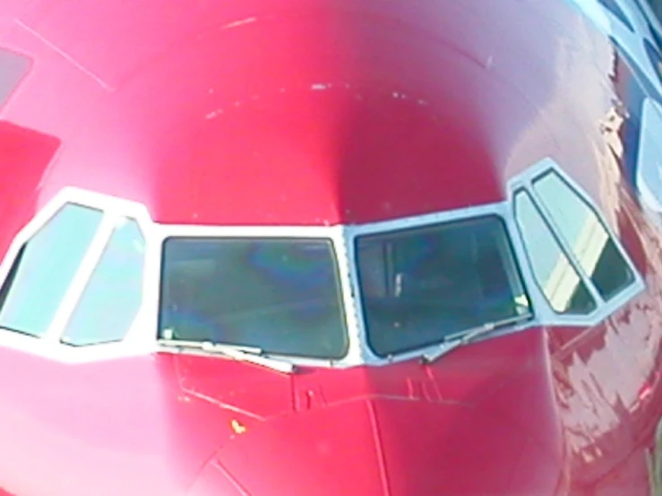 a view of the nose and window of a plane