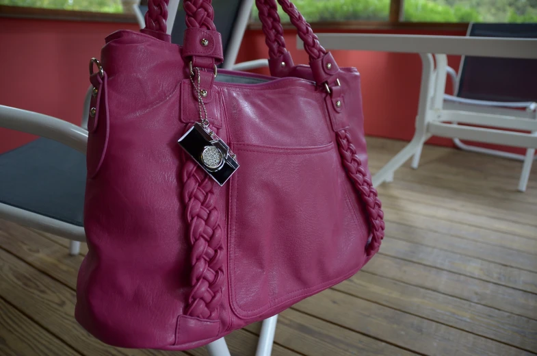 a purse that is attached to a chair