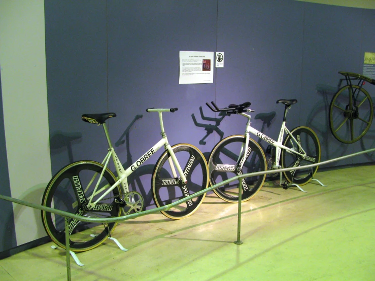 a group of three different sized bikes on display