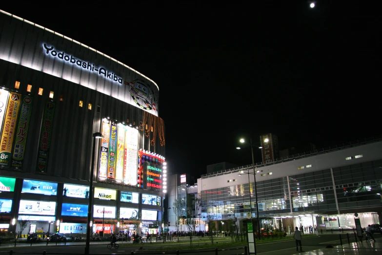 a city building at night with a lit up entrance