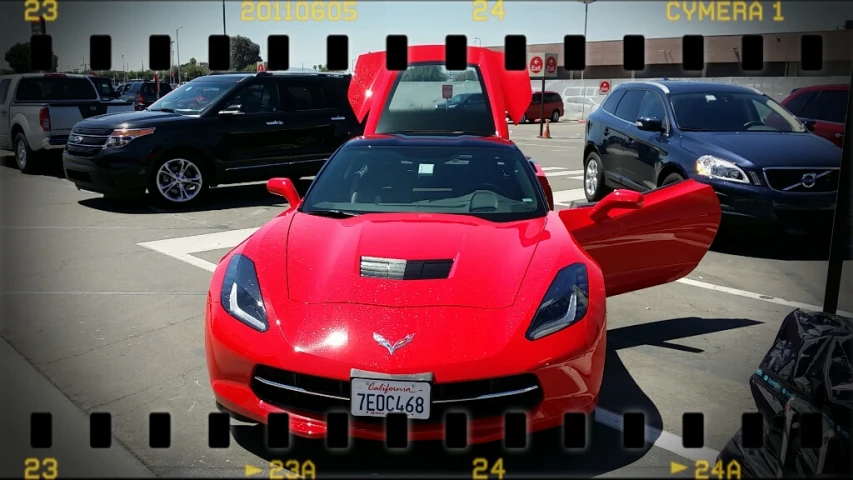 a car parked in a parking lot with other cars