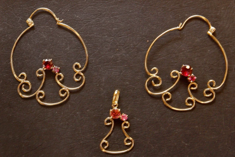 two earrings that look like fancy spirals