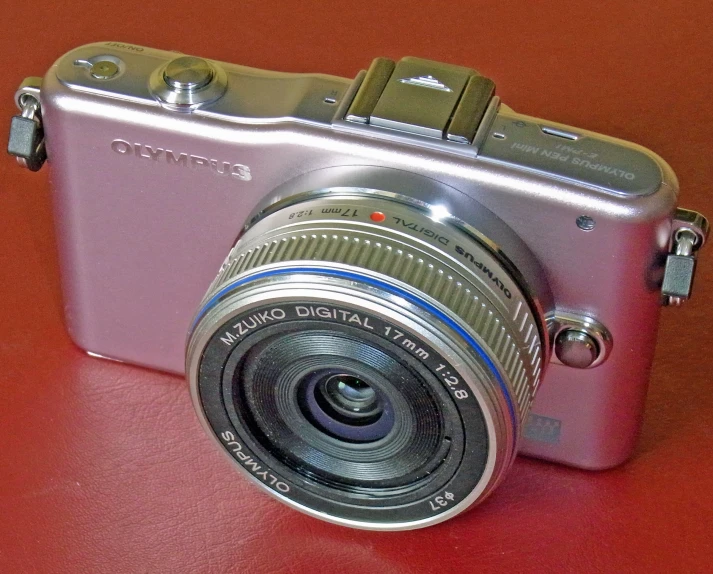 a camera sits on top of a red table