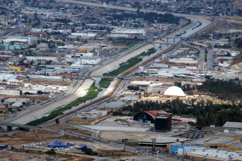 a very long and empty road is in the middle of a city