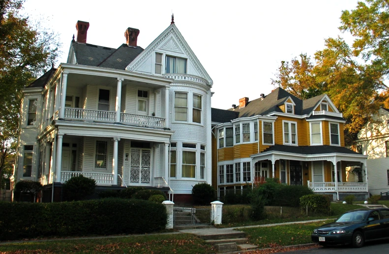 two large houses next to each other in the fall