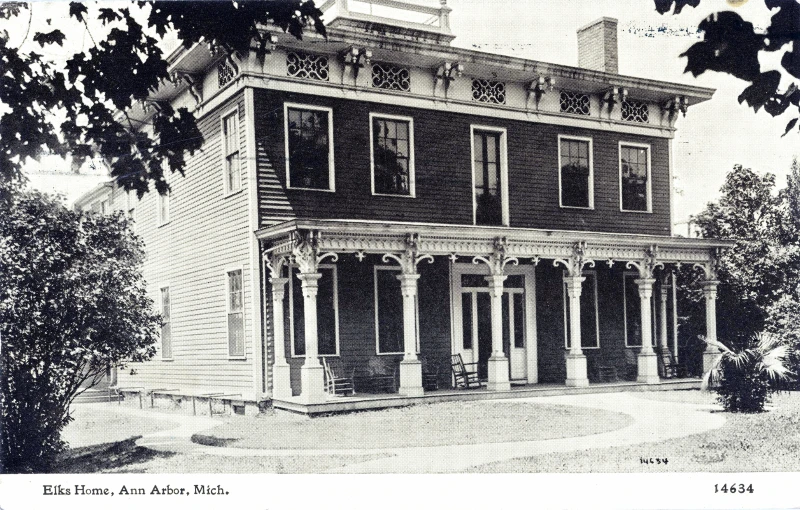 an antique po of a house with porches