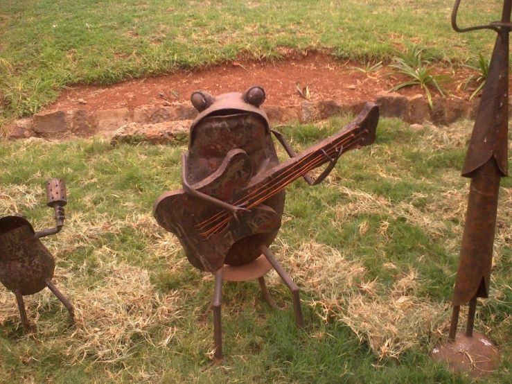 a unique sculpture depicting the cellphone guitarist