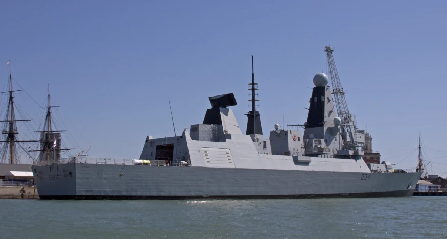 a large naval ship on the water