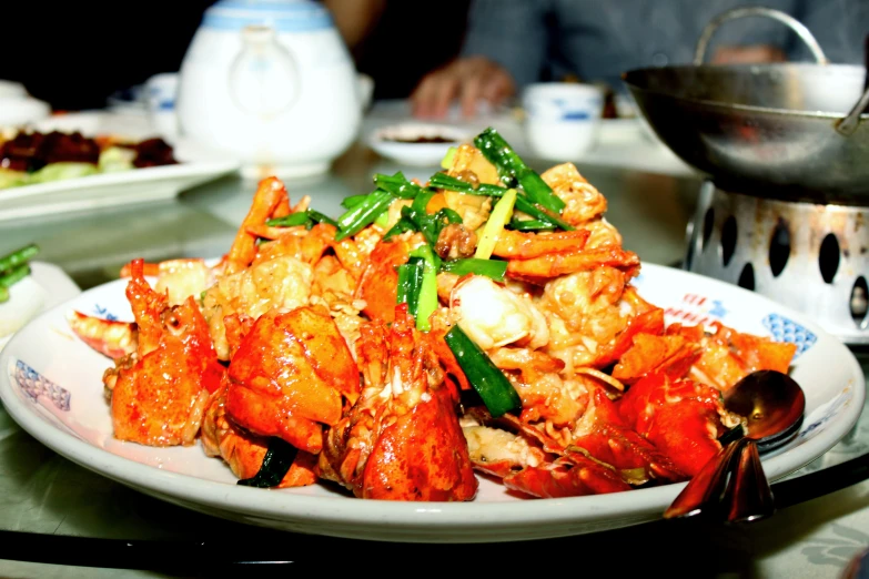 a bowl of lobster is displayed on a table