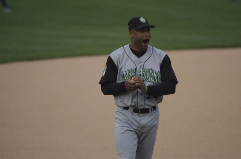 a baseball player yawns while giving a baseball presentation