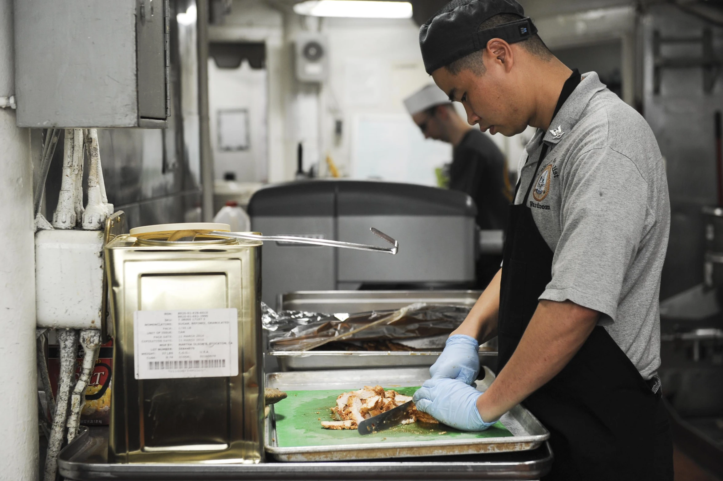 a man is preparing food inside a restaurant kitchen